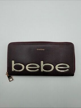 bebe Deep Burgundy Zip Wallet with Gold Logo